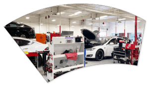 vehicles being worked on in a shop